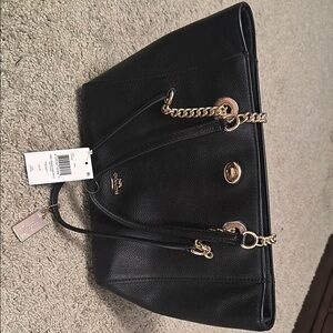 Coach Black Tote with Gold Accents and Structured Design